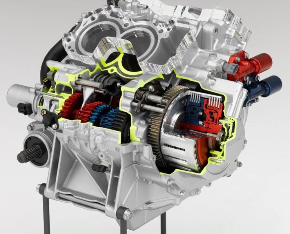 Cutaway of a Honda dual-clutch transmission showing the gearbox and its two clutches, highlighted in red and blue